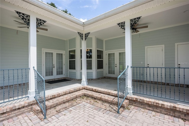 property entrance featuring french doors and ceiling fan