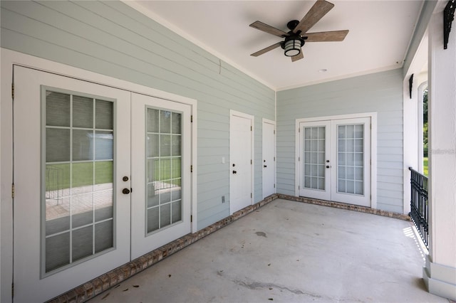 unfurnished sunroom with ceiling fan and french doors