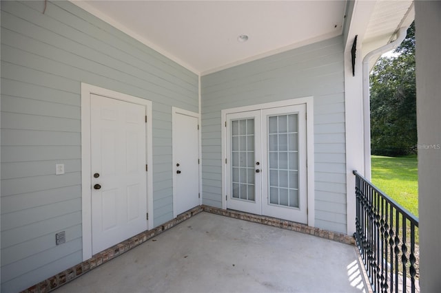 entrance to property featuring a patio area and french doors