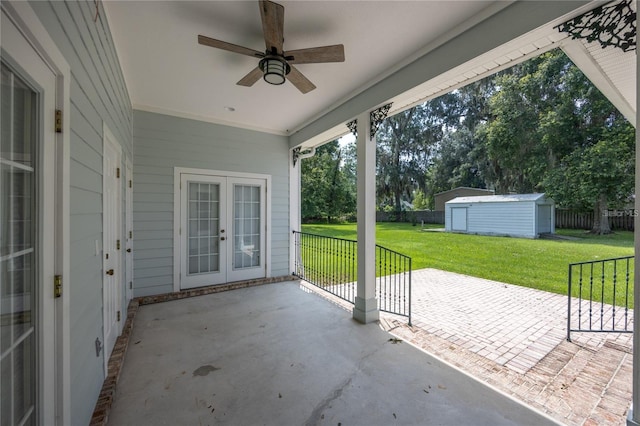 view of patio / terrace featuring french doors, ceiling fan, and an outdoor structure