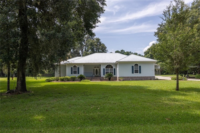 ranch-style house with covered porch and a front lawn