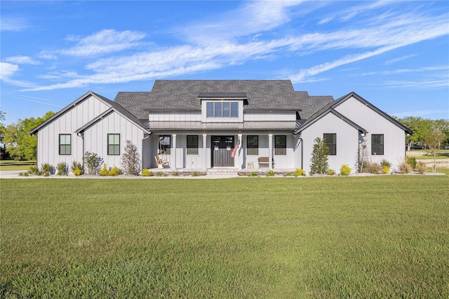 modern farmhouse with covered porch and a front yard