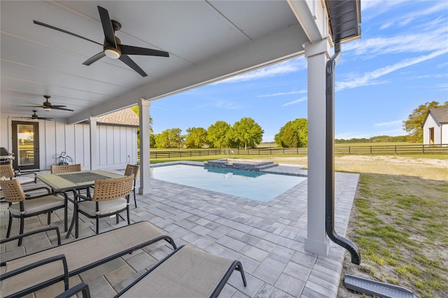 view of patio / terrace with a rural view and ceiling fan