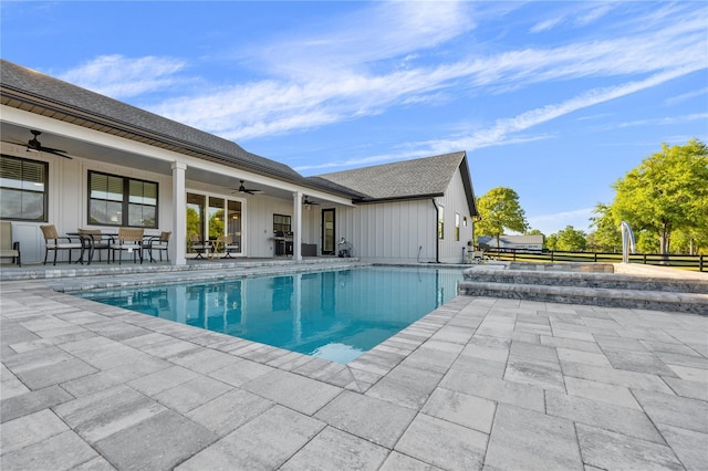 view of pool with ceiling fan and a patio area