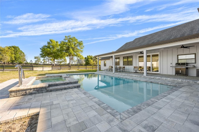 view of pool featuring ceiling fan, grilling area, an in ground hot tub, and a patio