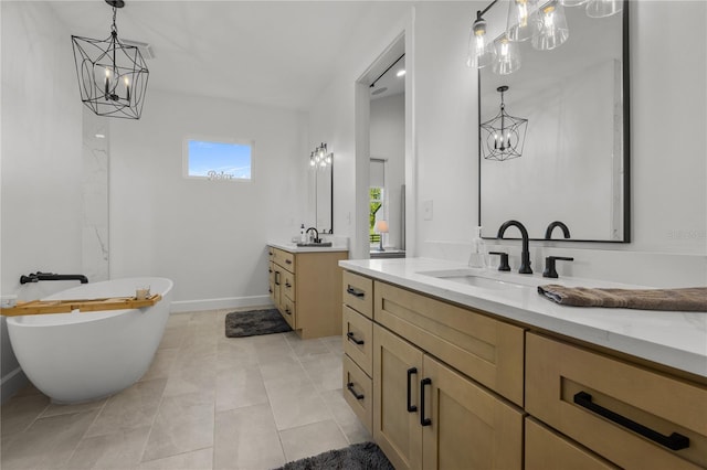 bathroom with tile patterned floors, vanity, and a tub