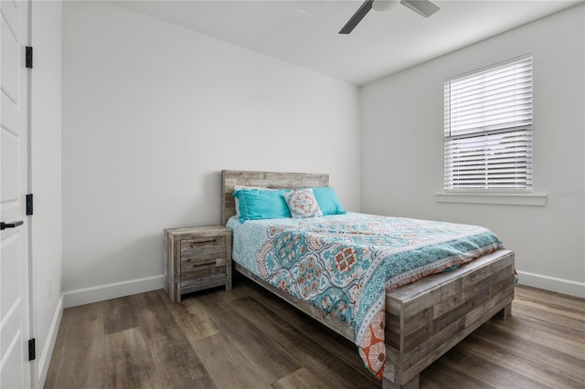 bedroom with ceiling fan and hardwood / wood-style flooring