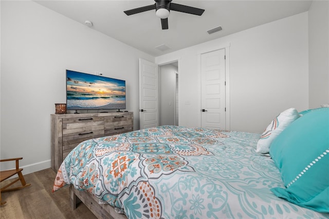 bedroom with ceiling fan and wood-type flooring