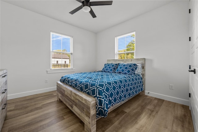 bedroom with ceiling fan and wood-type flooring