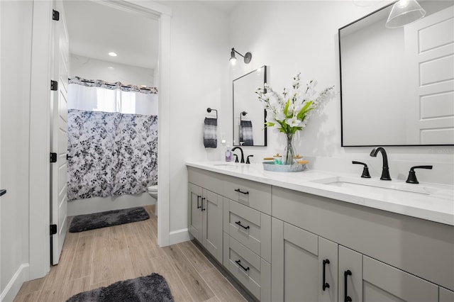 full bathroom with vanity, toilet, and shower / bath combo with shower curtain