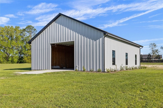 view of outdoor structure featuring a lawn