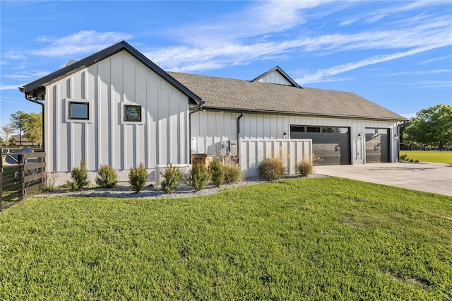 view of front of house with a front yard and a garage