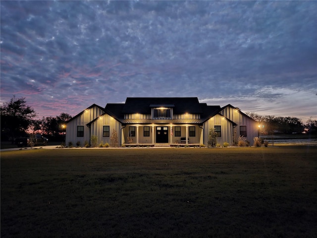 view of back house at dusk