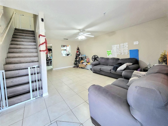 living room with light tile patterned floors and ceiling fan