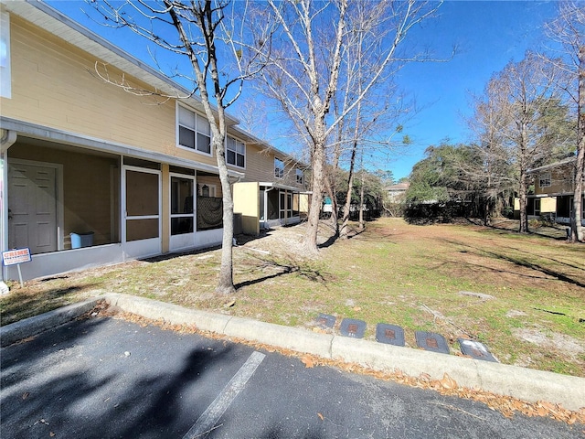 view of yard with a sunroom