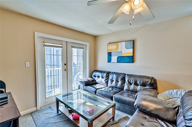 living room with light carpet, ceiling fan, and french doors