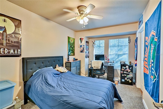 bedroom featuring ceiling fan and carpet floors