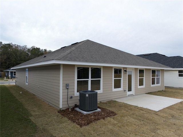 back of house featuring a patio area, central AC unit, and a yard