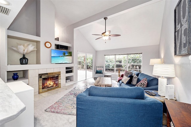 living room with ceiling fan, a fireplace, and high vaulted ceiling