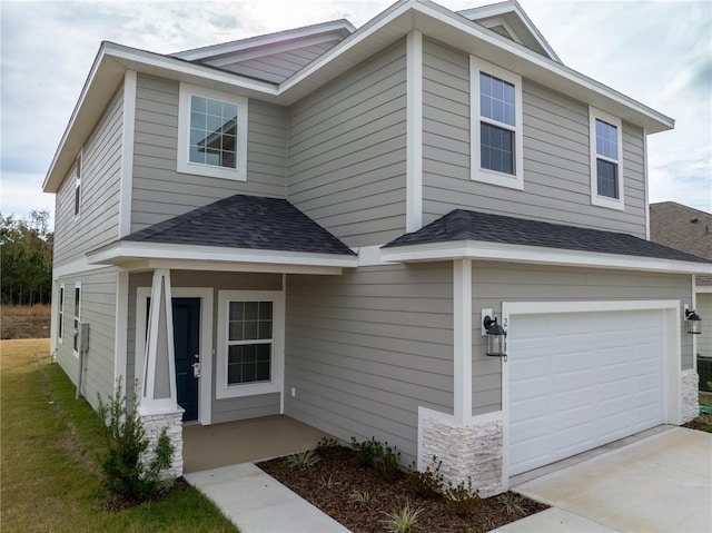 front facade with a garage and covered porch