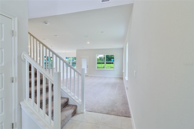 stairs featuring tile patterned floors