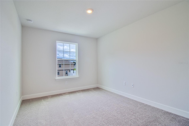 unfurnished room featuring carpet