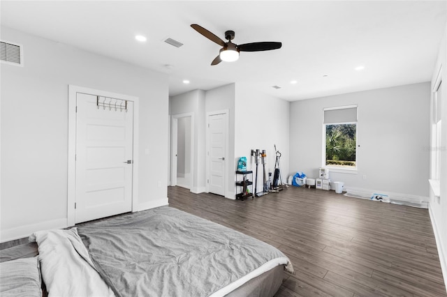 bedroom featuring ceiling fan and dark hardwood / wood-style floors