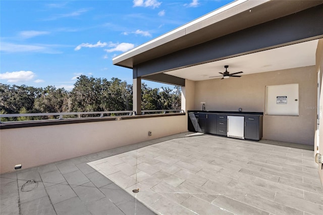 view of patio featuring ceiling fan