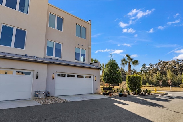 view of property exterior with a garage