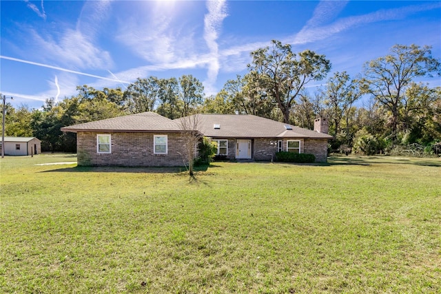 ranch-style home with a front lawn