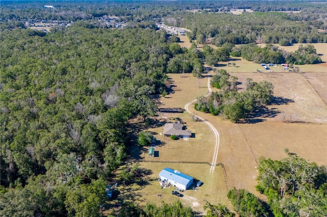 birds eye view of property with a rural view