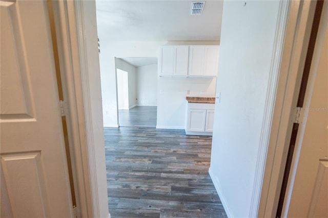 hallway featuring dark hardwood / wood-style flooring