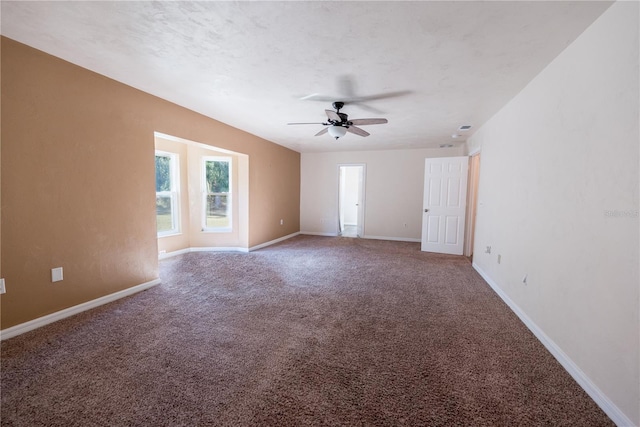 unfurnished room featuring ceiling fan and carpet floors