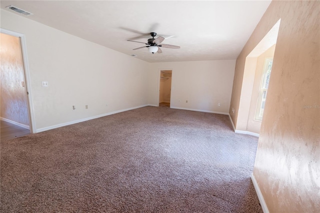 carpeted empty room featuring ceiling fan