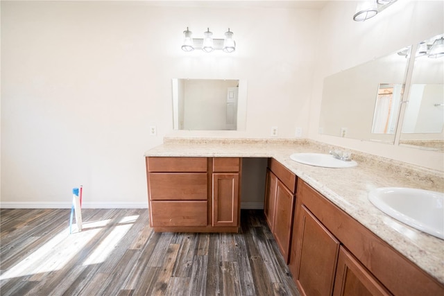 bathroom featuring vanity and wood-type flooring