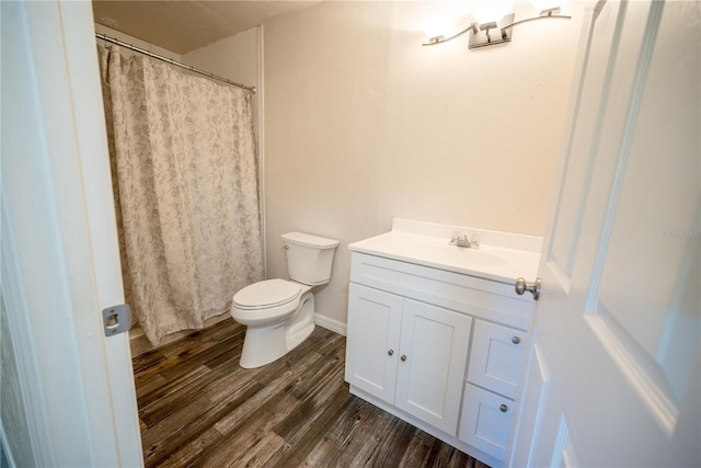 bathroom featuring hardwood / wood-style floors, vanity, and toilet