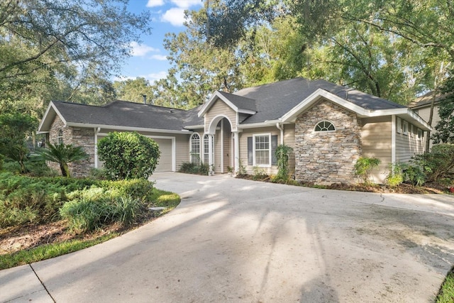 single story home with a garage