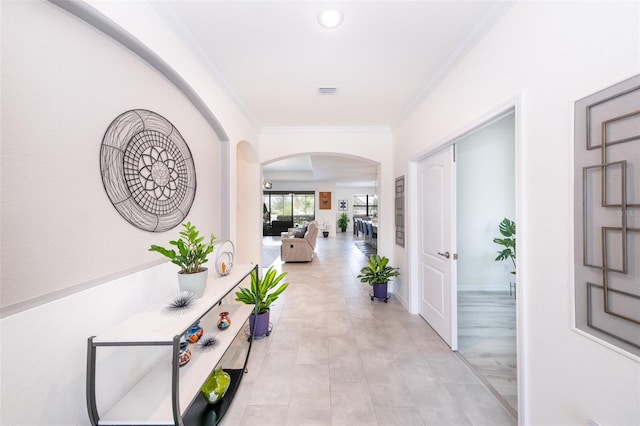 hallway featuring ornamental molding