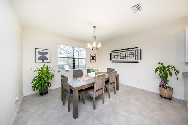 dining area with ornamental molding and a notable chandelier