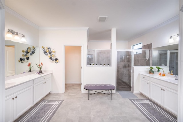 bathroom with ornamental molding, walk in shower, and vanity