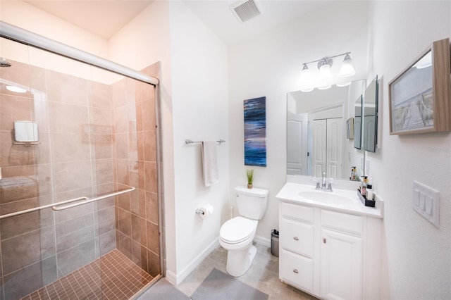 bathroom with toilet, tile patterned floors, walk in shower, and vanity