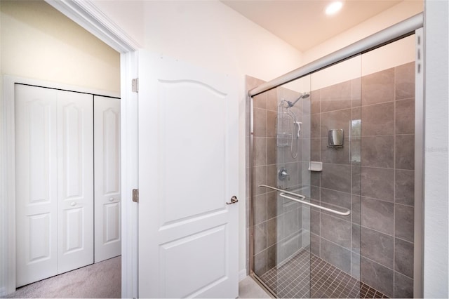 bathroom with a shower with shower door