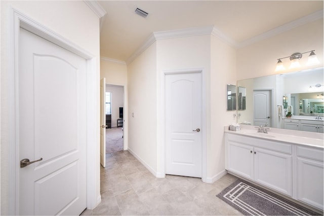 bathroom featuring ornamental molding and vanity