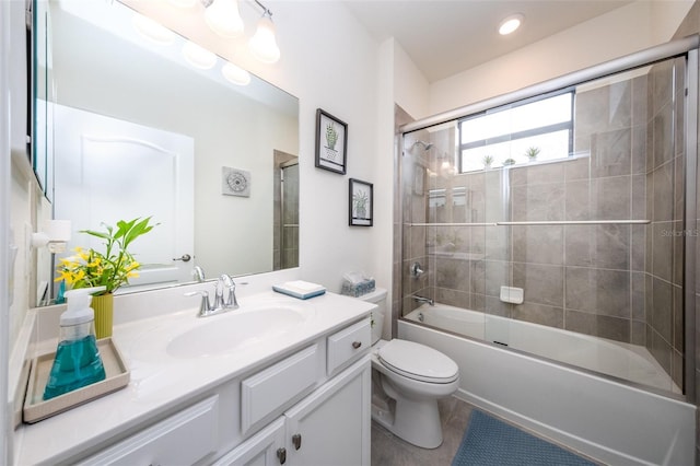 full bathroom featuring toilet, enclosed tub / shower combo, and vanity