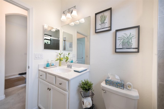 bathroom with toilet and vanity