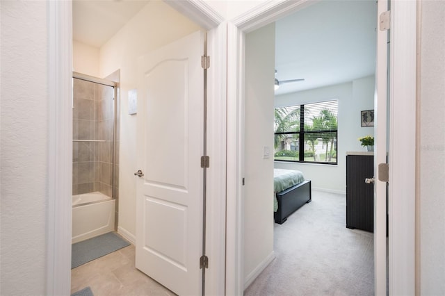 hallway with light colored carpet