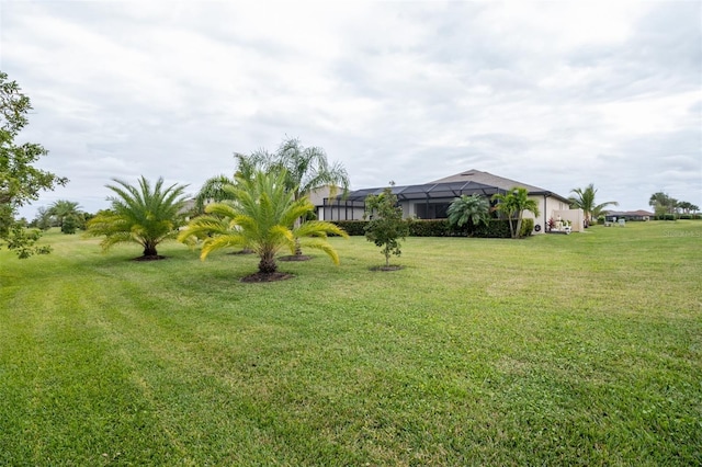 view of yard with a lanai