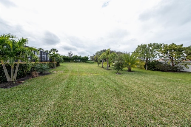 view of yard featuring a lanai