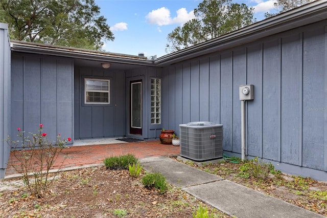 entrance to property featuring central air condition unit