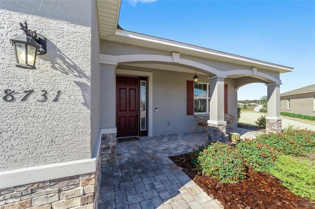 entrance to property with a porch